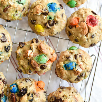 Loaded Monster Cookies pack in all the flavors with whole wheat pastry flour, nuts, oatmeal, popcorn, and coconut. And don't forget the chocolate for a healthy twist on dessert | foodiecrush.com