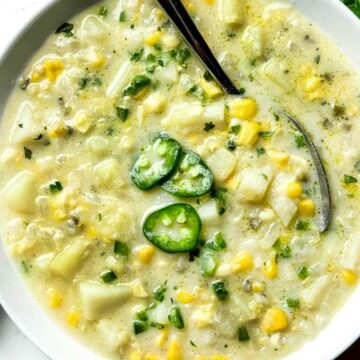 Potato Soup with Jalapeño and Corn in bowl with spoon foodiecrush.com