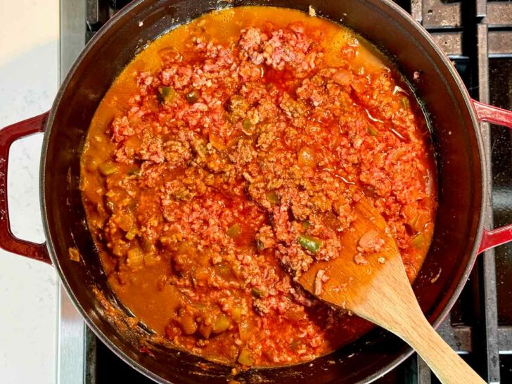 Classic Beef Chili Recipe with ground beef ingredients in stock pot foodiecrush.com