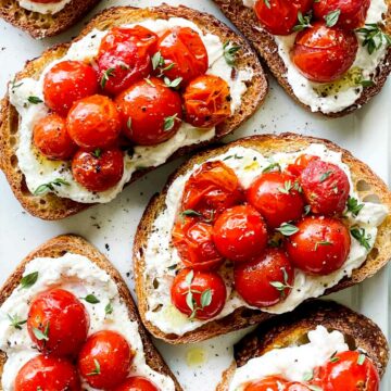 Whipped Ricotta Toast Crostini with Roasted Tomatoes foodiecrush.com